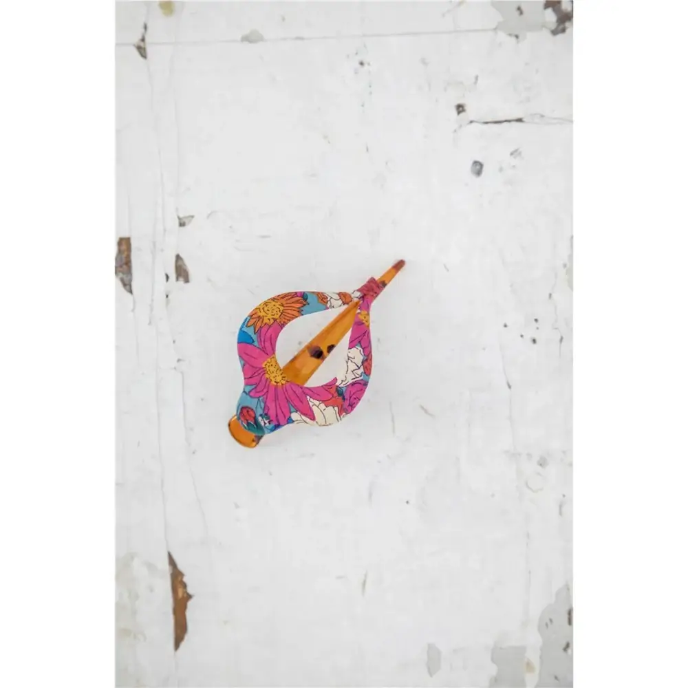 Pinza para el cabello con diseño floral azul y rosa